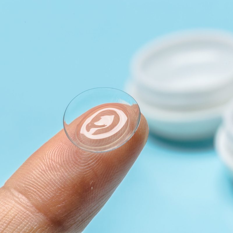 hand with contact lens hand with contact lens